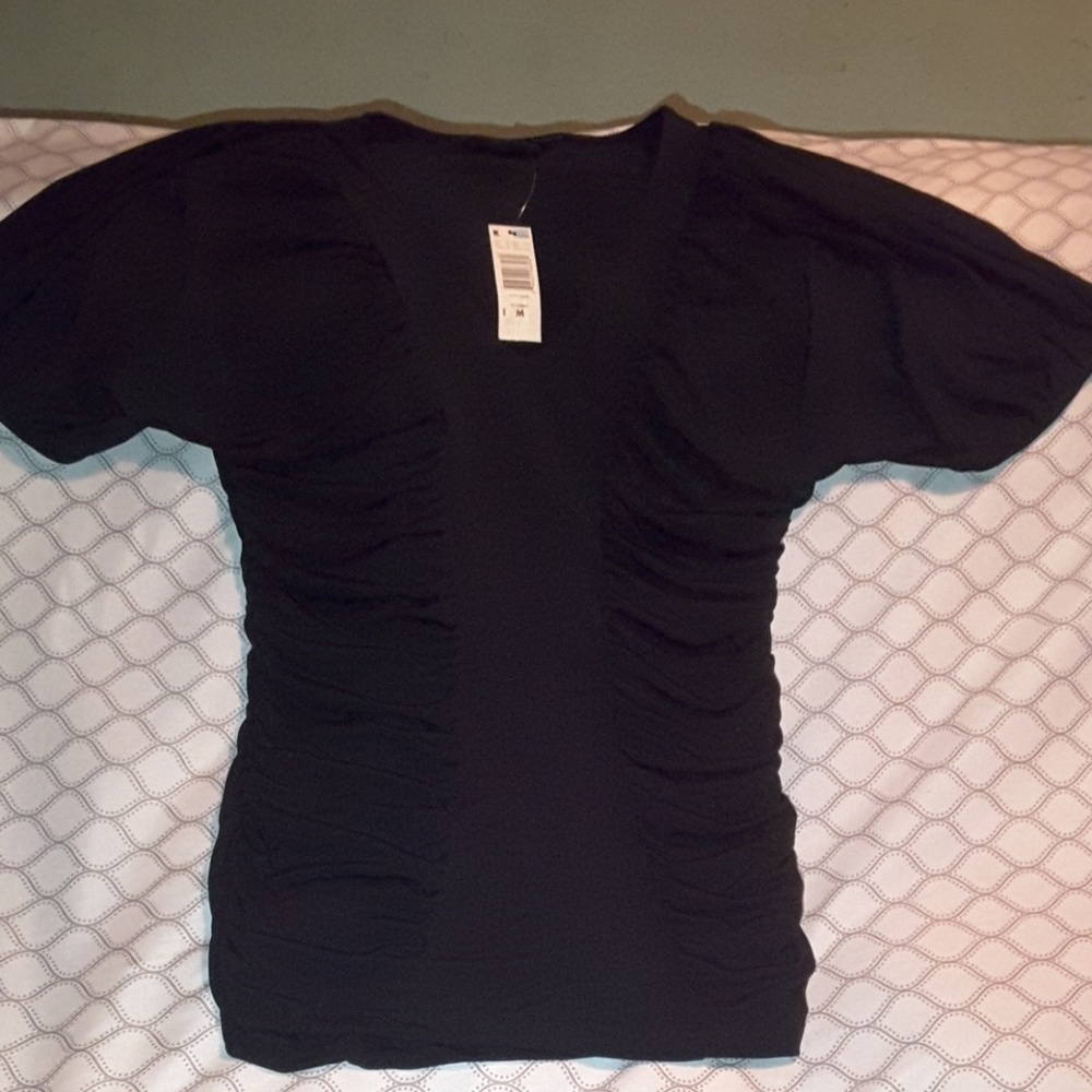 Black stretchy ruffle top medium from Attention